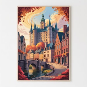 May include: A framed art print of a European townscape. The artwork depicts a large castle with multiple spires, a clock tower, and a bridge over a river. The buildings are in shades of beige, orange, and red, with autumn foliage.