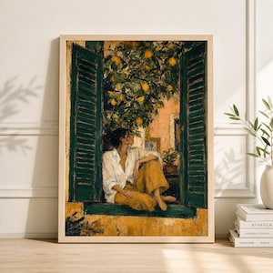 May include: A framed art print depicts a person seated in a window, looking out. The window has green shutters and a lemon tree outside. The person wears a white shirt and yellow pants. The artwork has a warm, inviting color palette.
