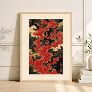 May include: Framed art print featuring a vibrant abstract design. The artwork showcases a flowing pattern of red and gold against a black background. The print is encased in a light-colored wooden frame, adding a touch of elegance to the piece.