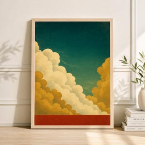 Könnte beinhalten: Ein gerahmter Kunstdruck mit einer stilisierten Darstellung von Wolken. Das Kunstwerk zeigt flauschige, weiße und goldene Wolken vor einem türkisblauen Himmel. Am unteren Rand befindet sich ein rotes horizontales Band. Der Druck ist in einem hellen Holzrahmen.