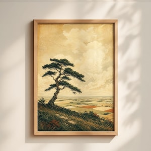May include: Framed landscape art print featuring a stylized tree on a hillside overlooking a valley. The artwork has a vintage aesthetic with a muted color palette of greens, browns, and yellows. The tree's dark green foliage contrasts with the light sky.
