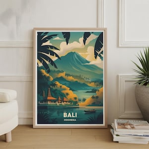 May include: A framed art print featuring a scenic view of Bali, Indonesia. The artwork depicts a mountain, lake, and traditional Balinese structures. The color palette includes shades of green, blue, yellow, and orange. The word "BALI" is printed at the bottom.