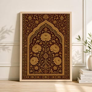 May include: A framed print featuring a detailed floral design in shades of gold and burgundy. The artwork showcases a central arch motif with symmetrical floral patterns, creating a rich and ornate aesthetic. The frame is a light wood color.