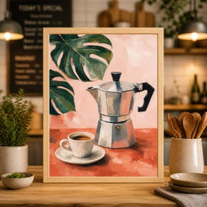 May include: A framed painting depicts a still life of a coffee setup. A silver stovetop espresso maker and a white cup and saucer with coffee sit on a red surface. Green monstera leaves and a pink background complete the scene.