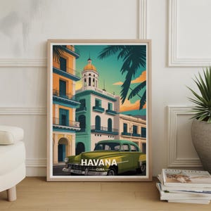 May include: Framed art print featuring a stylized illustration of Havana, Cuba. The artwork depicts colorful buildings, palm trees, and a vintage green car. The word "HAVANA" is displayed prominently.