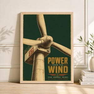 Puede incluir: Póster enmarcado con una ilustración vintage de un aerogenerador sobre un fondo verde oscuro. El texto dorado dice "POWER FROM THE WIND", con texto adicional que promueve la energía limpia y renovable. Marco de madera.