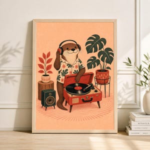 May include: A framed art print featuring an otter wearing headphones and a Hawaiian shirt, listening to a record player. The red record player is open, with a black vinyl record on the turntable. The background includes plants and a speaker.