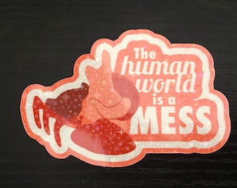 Pegatina holográfica de vinilo "El mundo humano es un desastre".