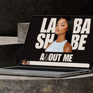 May include: A silver laptop shows a black screen with the words "LA BA SH BE ABOUT ME" in white text. An image of a woman is in the center. The laptop is on a grey, textured surface. The Canva logo and text are at the bottom.