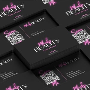 May include: Stack of black business cards with pink neon text that reads "Minks Beauty Lash Studio" and a QR code with the text "Scan Me".