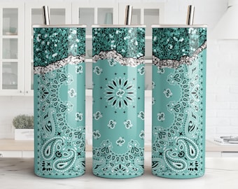 May include: Three stainless steel tumblers with a turquoise blue and white paisley pattern. The tumblers have a silver glitter accent at the top.