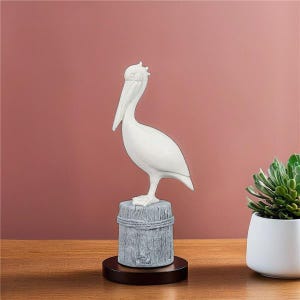 Polyresin Pelican on Pile Decor Blue/White