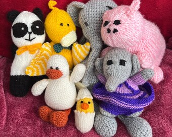 May include: A collection of knitted animal toys, including a panda, a yellow bird, a gray elephant, a pink pig, a white chick, and a gray elephant with a purple dress.
