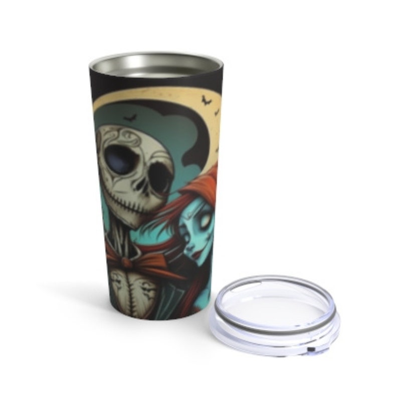 May include: A stainless steel tumbler with a black and white image of Jack Skellington and Sally from the Nightmare Before Christmas. The image is in a vintage style with a moon and bats in the background.