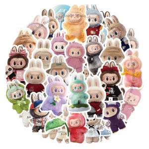 May include: A collection of colorful plush bunny figures with various outfits and accessories. The figures are in different colors, including pink, blue, and green, and some have hats or bows. The image includes the text "Fun Doodle Studio".