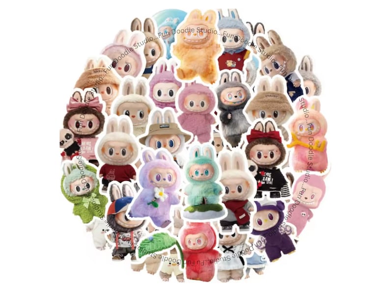 May include: A collection of colorful plush bunny figures with various outfits and accessories. The figures are in different colors, including pink, blue, and green, and some have hats or bows. The image includes the text "Fun Doodle Studio".