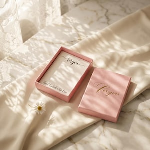 Pink gift box with 'for you' in gold script on the lid, holding a card that reads 'Hand Crafted With Love'.