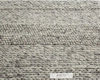 Tapis gris en laine épaisse de haute qualité dans des tons avec une touche de coton. Tapis gris marbré idéal pour s'adapter à de nombreux styles de décoration