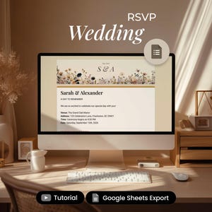 May include: A computer screen displays a wedding RSVP invitation with floral accents. The invitation reads "Sarah & Alexander" and includes event details. The word "Wedding" is at the top, and the screen sits on a wooden desk.