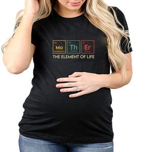 May include: Black t-shirt with a graphic of the periodic table elements Mo, Th, and Er, with the text "The Element of Life".