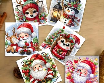 May include: A collection of Christmas-themed greeting cards featuring watercolor illustrations. The cards depict Santa Claus, reindeer, a snowman, and a hedgehog, all adorned in festive attire. The cards are square and arranged on a wooden surface.