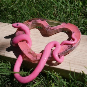 May include: A set of three ceramic mugs with a speckled, matte finish. The mugs are in shades of cream, light gray, and dark gray. Each mug has a simple, minimalist design, perfect for coffee or tea.