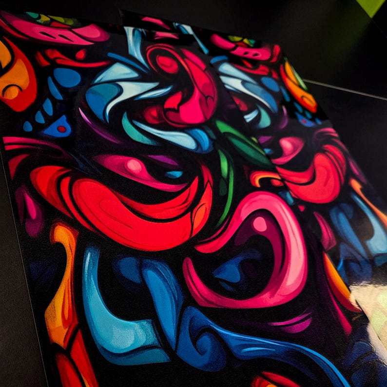 May include: Abstract art print featuring a vibrant, swirling design. The artwork showcases a dynamic composition of bold colors, including red, blue, pink, green, and orange, set against a black background. The flowing shapes create a sense of movement and energy.