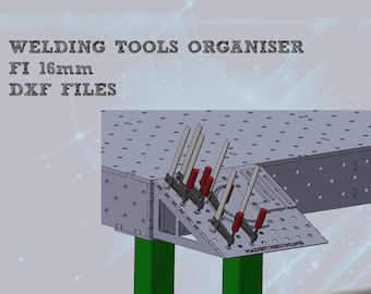 May include: A metal welding table with a green support leg and a metal extension with clamps. The table has a grid pattern and the extension has the text "WELDERTABLEONLINE".