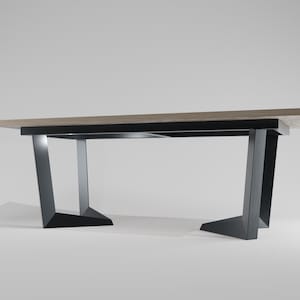 May include: A modern wooden desk with a light brown tabletop and black metal legs. The legs have a unique angled design, providing a sturdy base. The desk is suitable for a home office or workspace.