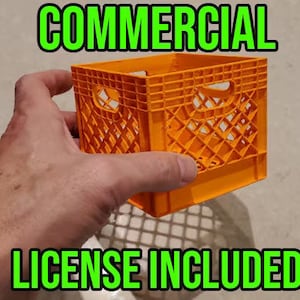 May include: Orange plastic crate with a grid pattern. The crate is being held by a hand. The text "COMMERCIAL" is above the crate and the text "LICENSE INCLUDED" is below the crate.