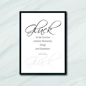 May include: Black and white printable wall art with a quote about happiness. The quote reads "Glück ist die Summe schöner Momente, Dinge und Gedanken."  The quote is attributed to Monika Kreuzburg.
