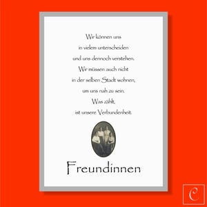May include: A framed print with a white border and an orange background. The print features German text and a vintage photograph of four people. The word "Freundinnen" is written in a decorative font at the bottom.