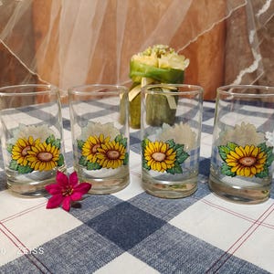 A set of four Vintage Signed Crisa Sunflower Juice Glasses 6 oz Capacity, Yellow Blue