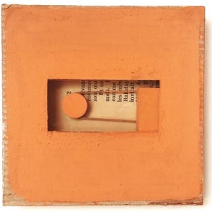 May include: A terracotta-colored square tile with a rectangular opening. Inside the opening is a piece of paper with text and a small orange circle. The text reads: "2 ivan commer son œu Et co mels. I con me les mên Rabelai invitait A p pa"