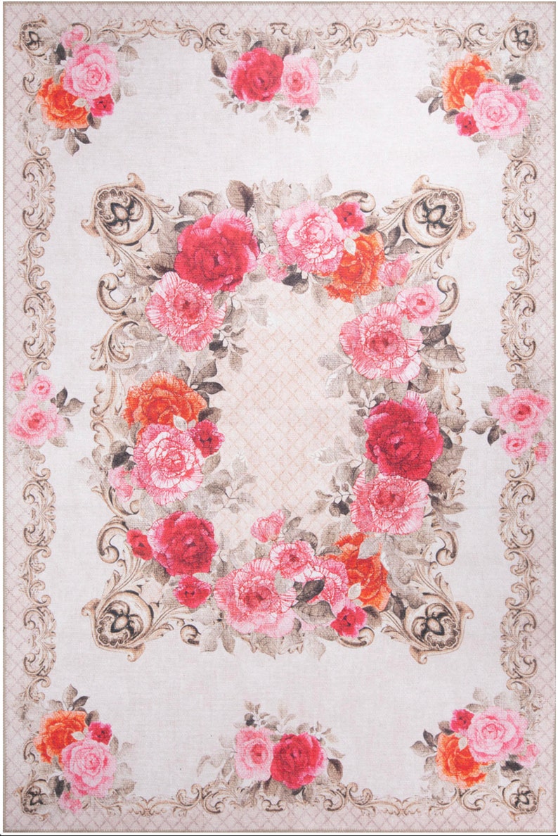 May include: A beige rug with a floral design featuring pink, red, and orange roses. The roses are arranged in a circular pattern within a decorative frame.