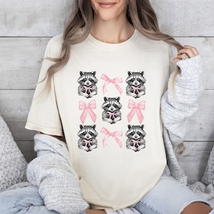 Coquette Raccoon Shirt, Comfort Colors Pink Bow Raccoon Tee, Girly Shirt, Trash Panda Gift, Coquette Aesthetic Pink Soft Girl T-Shirt