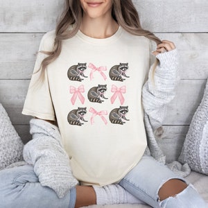 Coquette Raccoon Shirt, Comfort Colors Pink Bow Raccoon Tee, Girly Shirt, Wildlife Lover Gift, Coquette Aesthetic Pink Soft Girl Tee Shirt