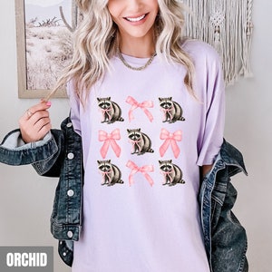 Coquette Raccoon Shirt, Comfort Colors Pink Bow Raccoon Tee, Girly Shirt, Wildlife Lover Gift, Coquette Aesthetic Pink Soft Girl Shirt