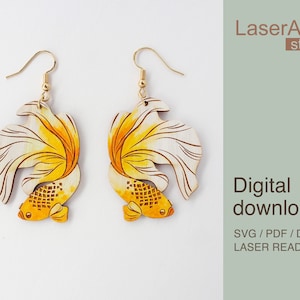 Pode incluir: Um par de brincos de madeira cortados a laser com um design de peixe dourado amarelo e branco. Os brincos estão prontos para serem montados e são perfeitos para uma cortadora a laser.