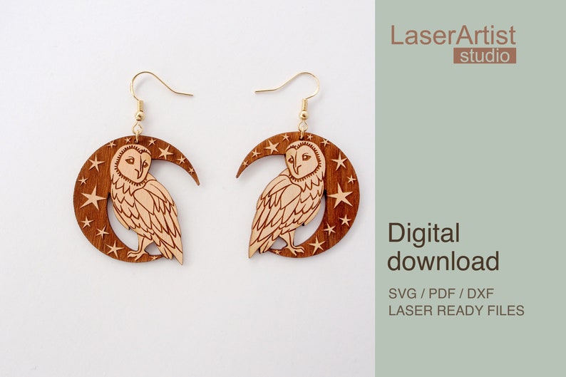 May include: A pair of laser cut wooden earrings featuring a crescent moon with stars and an owl. The earrings are brown with a light brown owl and stars. The text "LaserArtist studio" and "Digital download SVG / PDF / DXF LASER READY FILES" is in the background.