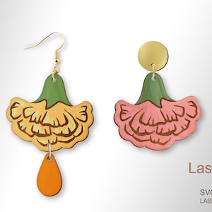 May include: A pair of wooden earrings featuring a flower design. The earrings are painted in shades of yellow, pink, green, and orange. The earrings are laser cut and ready to be assembled.