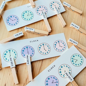 Montessoripeuter, montessorimaterialen, educatief speelgoed, montessorispeelgoed, lesklok, kloklesspel, thuisschoolprintables