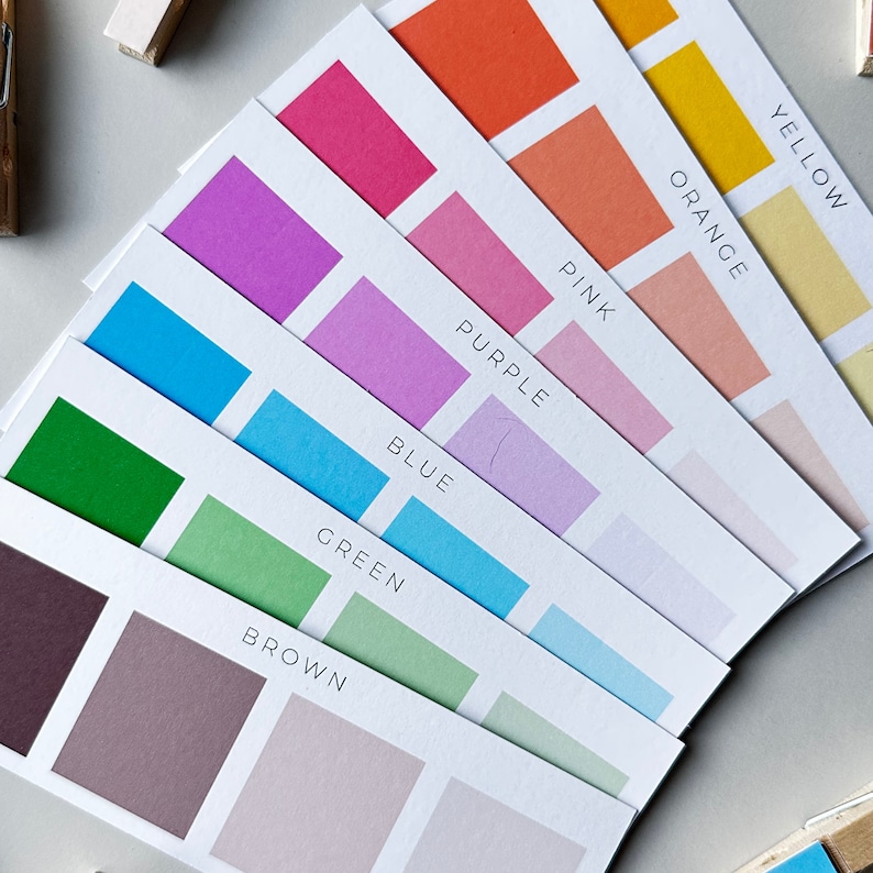 May include: A set of color swatches with the names of each color printed on the cards: Brown, Green, Blue, Purple, Pink, Orange, and Yellow.