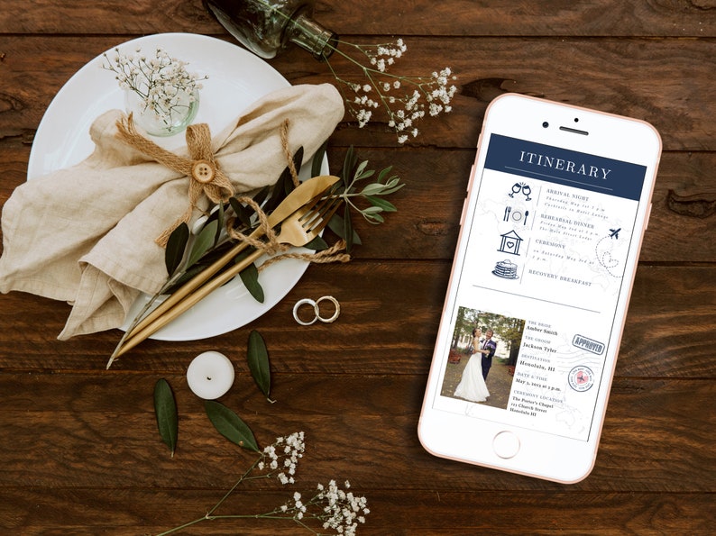 May include: A smartphone displaying a wedding itinerary with a blue and white color scheme. The itinerary includes details for the arrival night, rehearsal dinner, ceremony, and a discovery breakfast. The phone is on a wooden table with a white plate, a napkin, and a gold fork and knife.