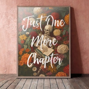 May include: A skeleton surrounded by colorful flowers and greenery is reading a book with the text "Just One More Chapter" written in white cursive.