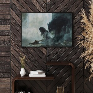 May include: A framed painting depicting a woman with long dark hair sitting on the ground with a large wolf-like creature behind her. The painting is set against a dark, misty background.