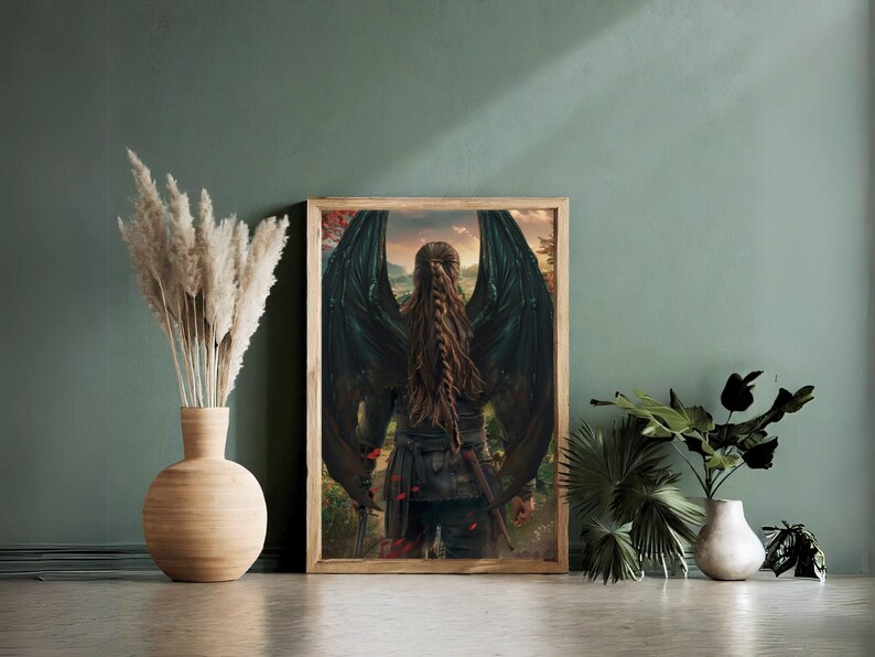 May include: A framed fantasy art print featuring a person with long brown hair and large black wings standing in a forest setting.