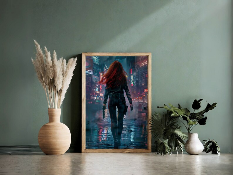 May include: A framed print of a woman with red hair walking down a neon-lit city street at night. The woman is wearing a black leather jacket and jeans. The city is full of tall buildings and bright lights.