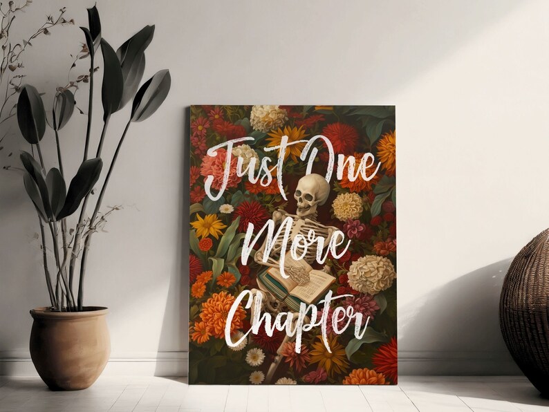 May include: A skeleton reading a book surrounded by colorful flowers. The text reads "Just One More Chapter".