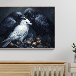 May include: A white dove with black feathers sits between two black ravens. The birds are perched on a branch with brown and gold acorns scattered around them.